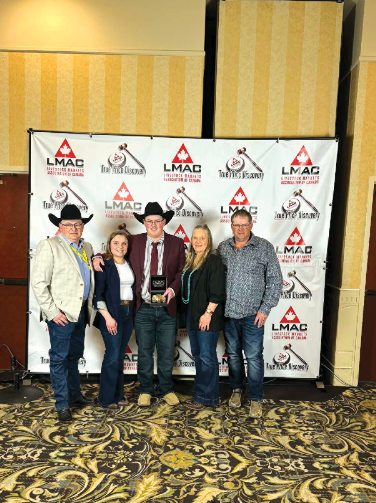 Ty Cutler with his family at the Canadian Livestock Auctioneer Championship.<br />
